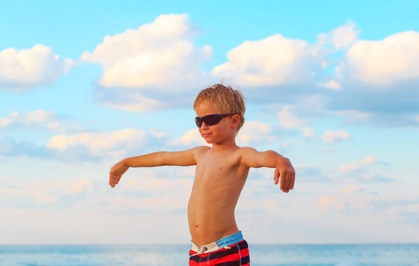 little boy play flying on tropical beach - Photo, Image