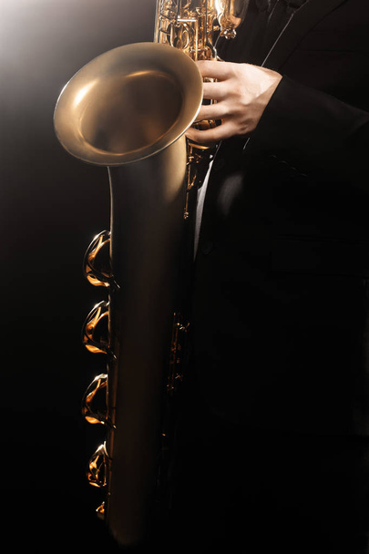 Saxophone player Saxophonist playing jazz music instrument sax - Фото, изображение
