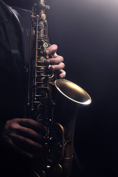 Saxophone player Saxophonist playing jazz music instrument sax - Zdjęcie, obraz
