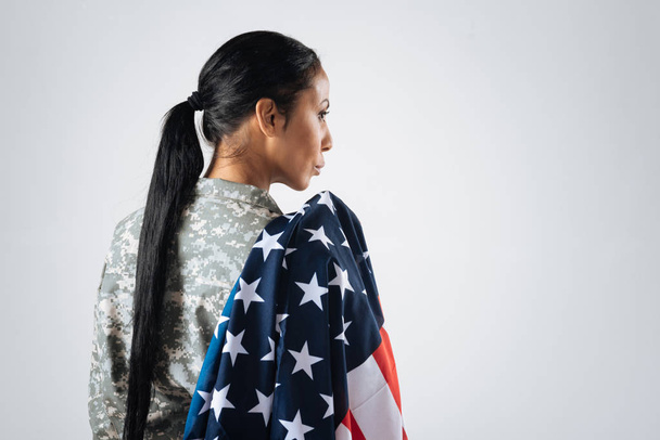 military woman  holing american national flag  - Fotó, kép