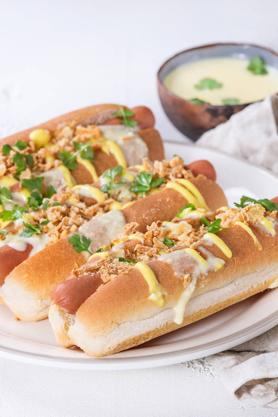 Hot dogs with cheese sauce and mustard - Fotografie, Obrázek