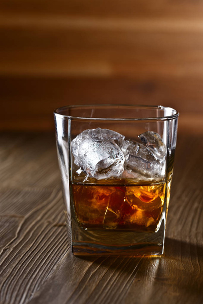 Glass of whiskey with natural ice  - Fotoğraf, Görsel
