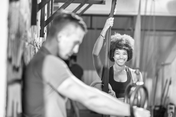 Portrait of multiethnic couple  after workout at gym - Photo, Image