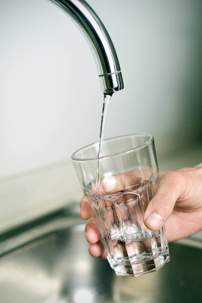 man filling a glass of tap water - Photo, Image