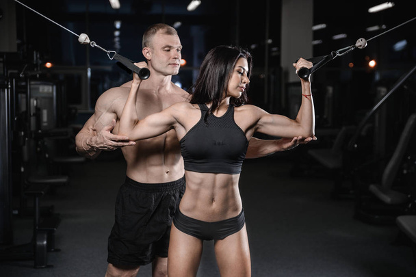 sexy caucasian man and woman in gym - 写真・画像