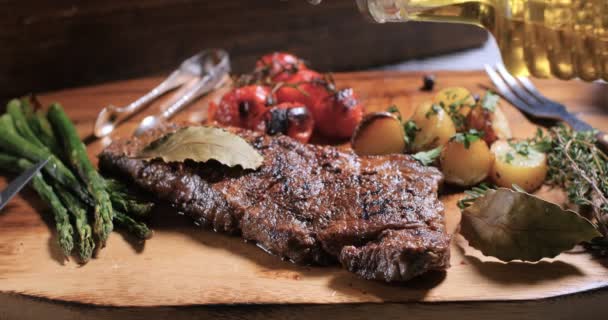 Pouring olive oil over a delicious sirloin steak - Footage, Video