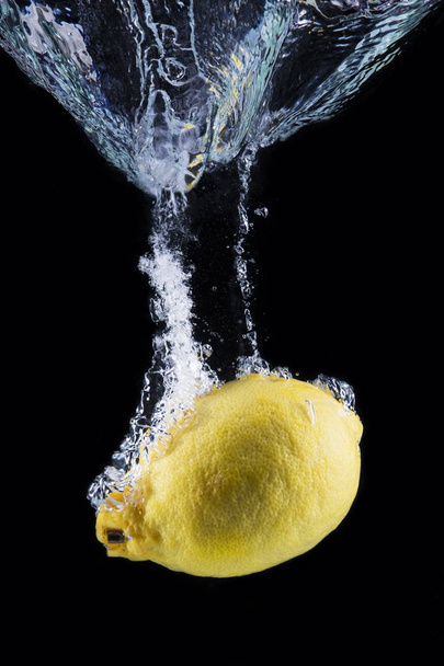 lemon underwater isolated on black background - Photo, Image