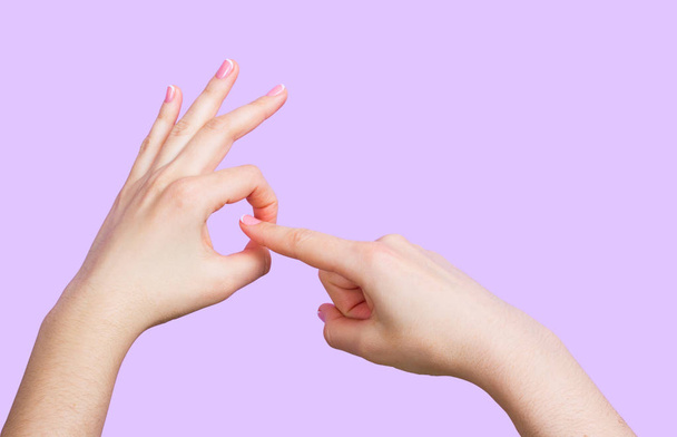 Hand of girl doing sex gesture - Фото, зображення