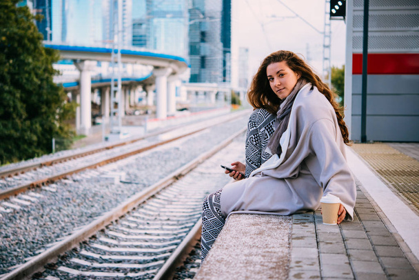 Young woman waiting for the train - Фото, зображення