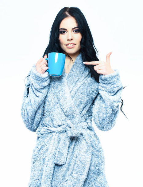 sexy girl posing in blue velour bathrobe with cup - Zdjęcie, obraz