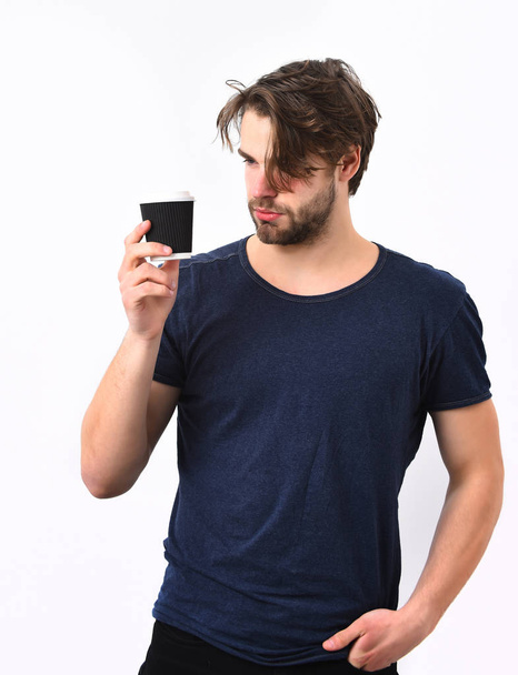 Caucasian sexy young macho holding coffee cup - Фото, изображение