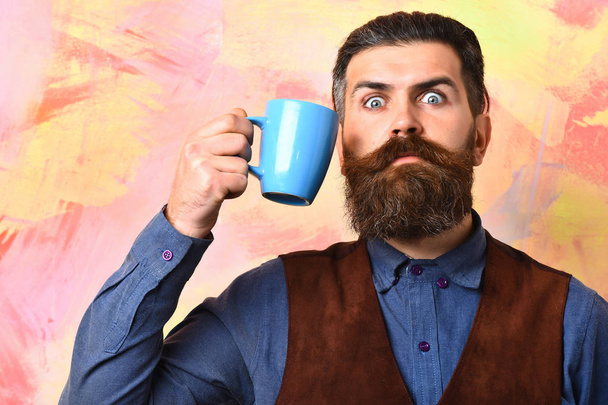 Bearded brutal caucasian hipster with coffee cup - Фото, зображення