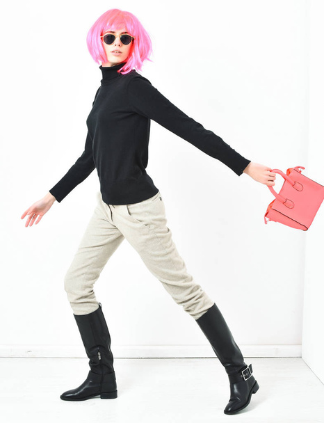 fashionable sexy girl in pink wig posing with fashion bag - Fotografie, Obrázek