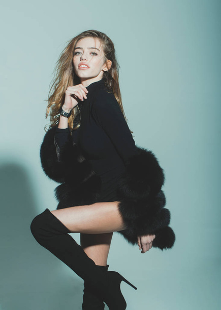 pretty sexy woman with long hair in fur and jackboot - Photo, image