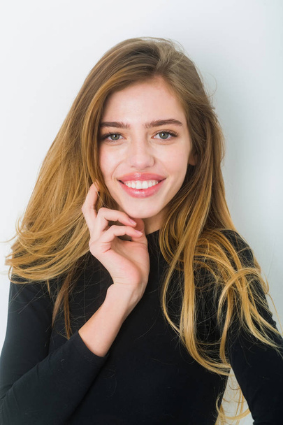 sexy pretty smiling girl with long blond hair in black - Fotografie, Obrázek