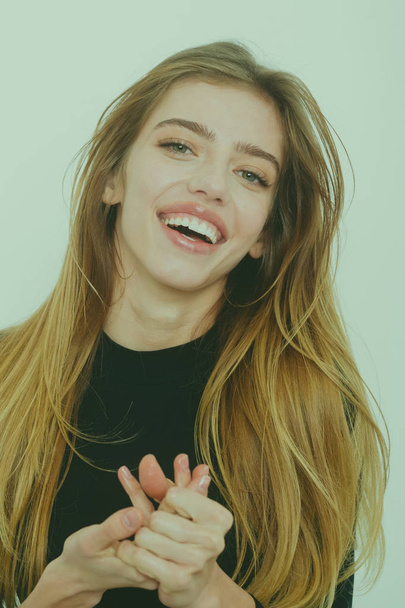 Happy pretty girl with long blond hair in black - Photo, image