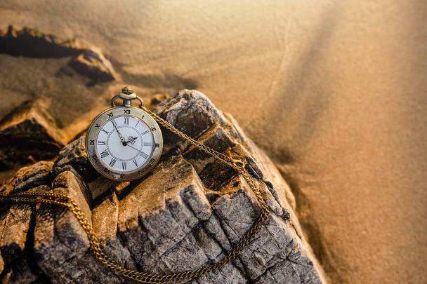 Vintage pocket watch on the beach  - Photo, Image