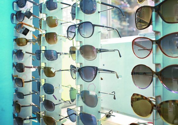 Showcase with different sunglasses - Фото, зображення