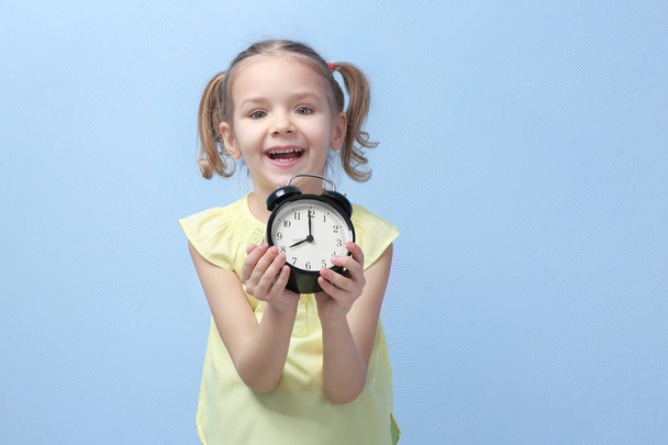 little girl with alarm clock  - Foto, Bild