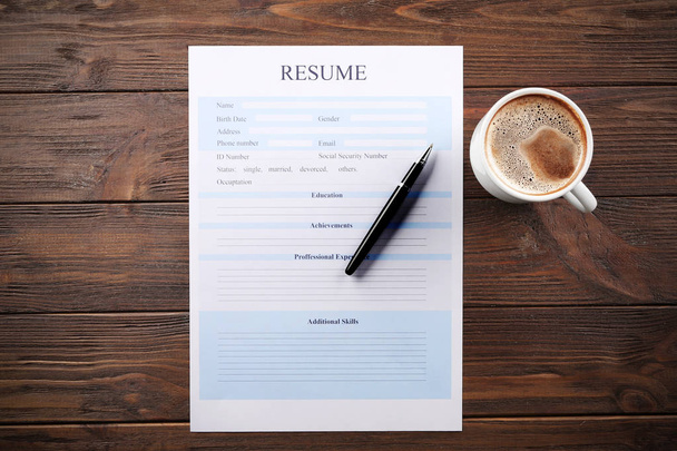 Cup of coffee and resume form - 写真・画像