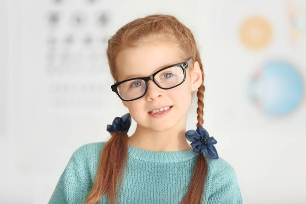 Cute little girl with glasses  - Фото, изображение