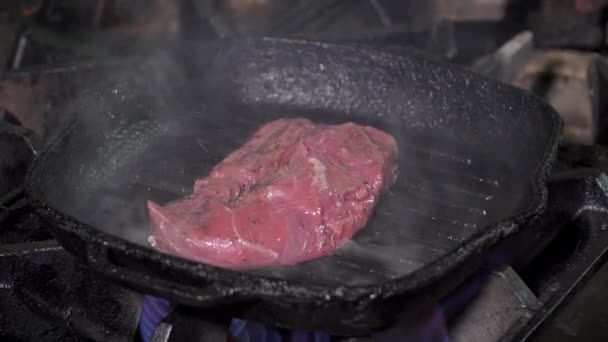 Cooking tasty stake on a pan - Filmati, video
