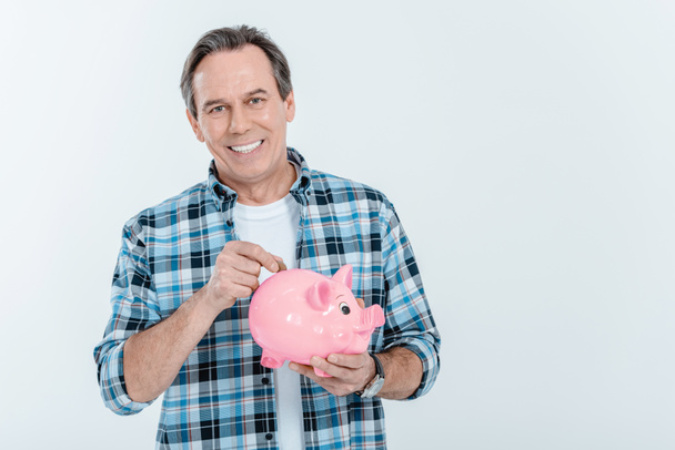 Man holding piggy bank - Photo, Image