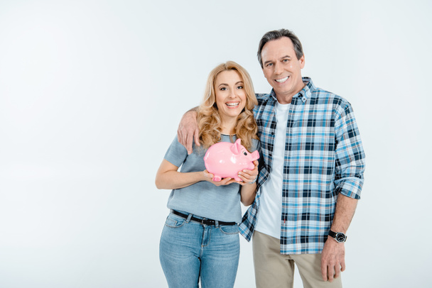 Couple holding piggy bank  - Photo, Image