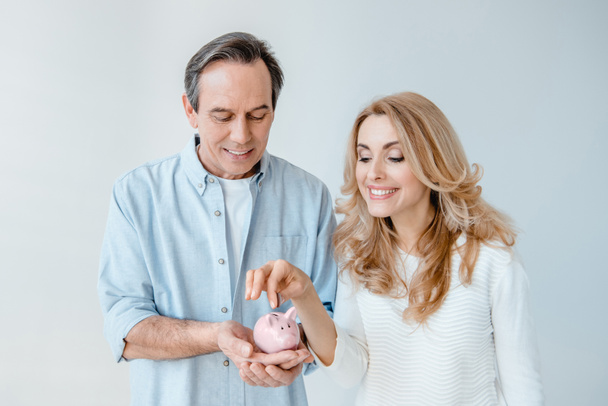 Mature couple with piggy bank  - Photo, Image
