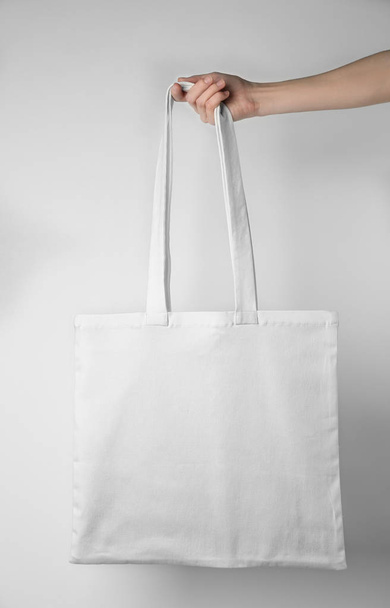 Hand holding shopping bag  - Photo, image