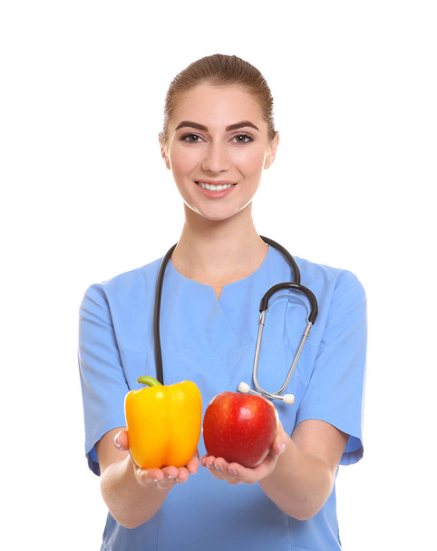 Young female nutritionist on white background - Foto, immagini