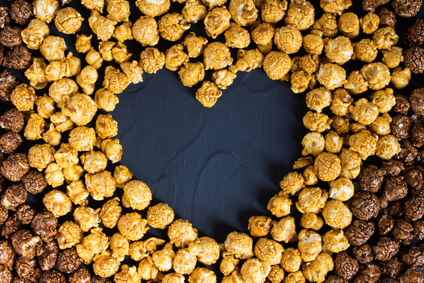 Chocolate caramel popcorn with heart shape - Photo, Image