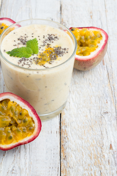Smoothies passion fruit, milk and chia seeds in a glass on a white background - Photo, Image