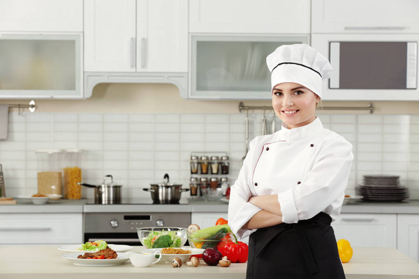 woman chef in modern kitchen - 写真・画像