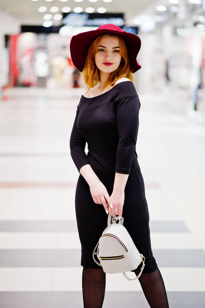 Fashion red haired girl wear on black dress and red hat with lad - Φωτογραφία, εικόνα