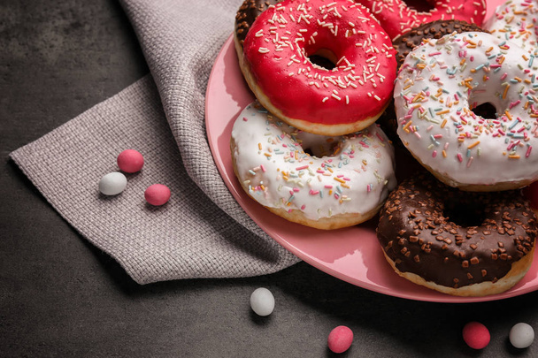 Tasty donuts on plate - Photo, image