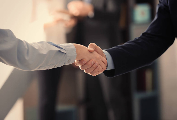 Closeup of business handshake indoors - Foto, imagen