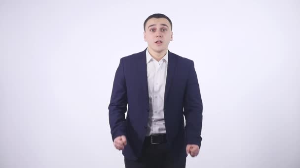 man getting excited by results on white background - Záběry, video