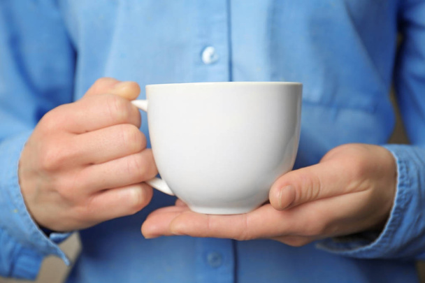white cup in hands - Foto, imagen