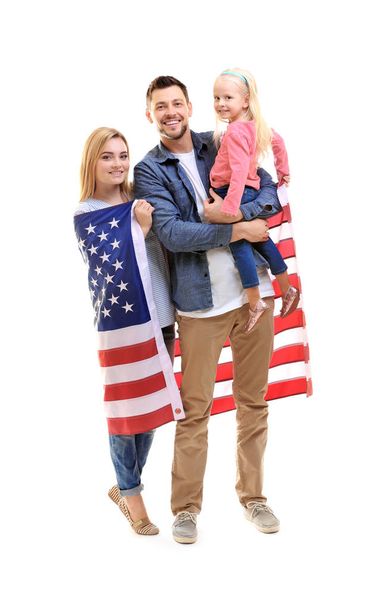 Happy family with American flag on white background - 写真・画像
