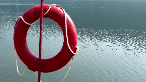 Red Life Buoy Against the Water - Footage, Video