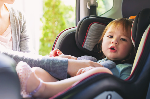 Toddler girl in car seat - Foto, Imagen