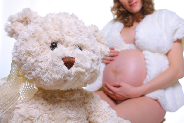 Pregnant woman & teddy bear - Photo, Image