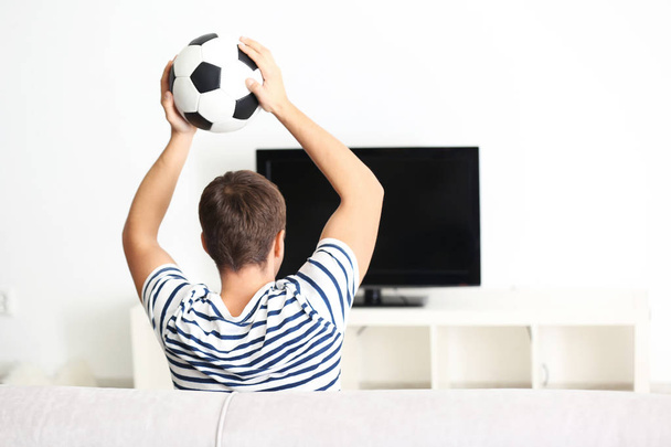 Teenager watching football match  - Photo, Image