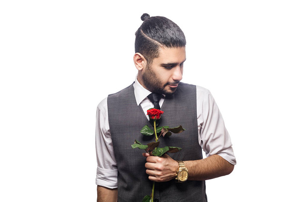 Handsome romantic happy man with rose flower.  - Foto, afbeelding