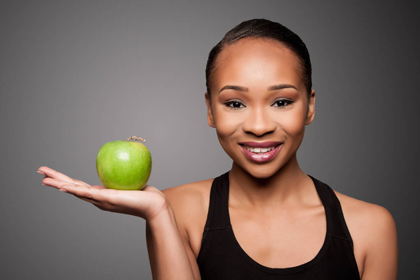 Happy healthy black asian woman with apple - Zdjęcie, obraz