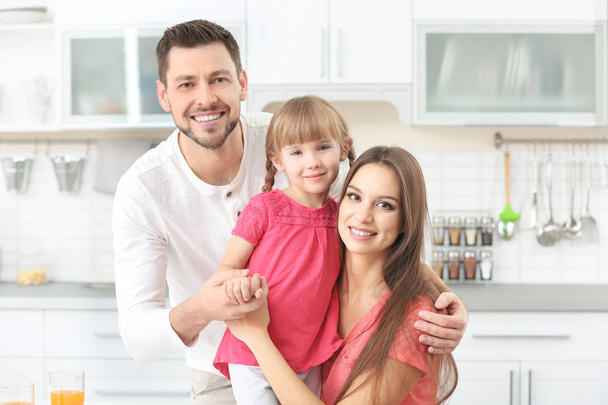 Happy family on kitchen at home - Foto, Bild