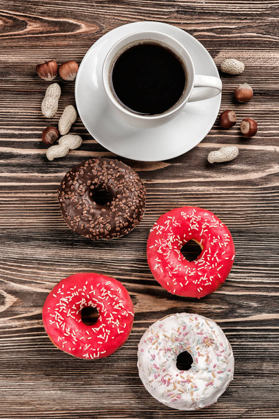 Tasty donuts with cup of coffee  - Photo, Image