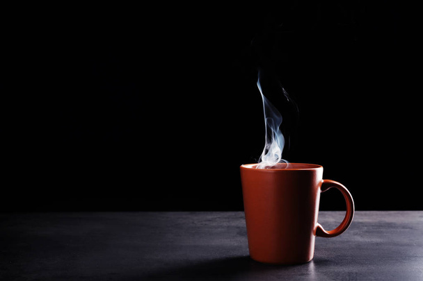 Cup with hot liquid  - Фото, зображення