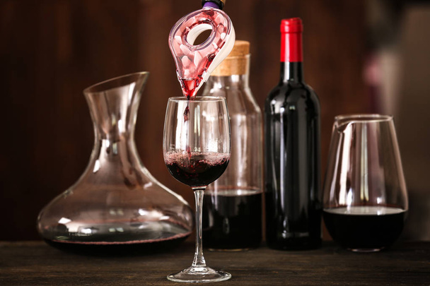 Pouring wine in glass  - Photo, image